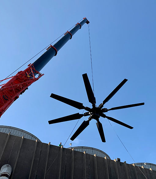 Image of large industrial fan being set in place