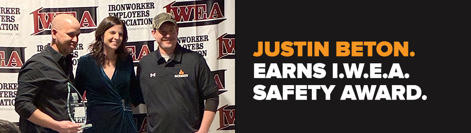 Justin Beton and TJ Bayer presented with John P. "Jack" Daley Safety award by Danielle Harshman, the IWEA Executive Director.