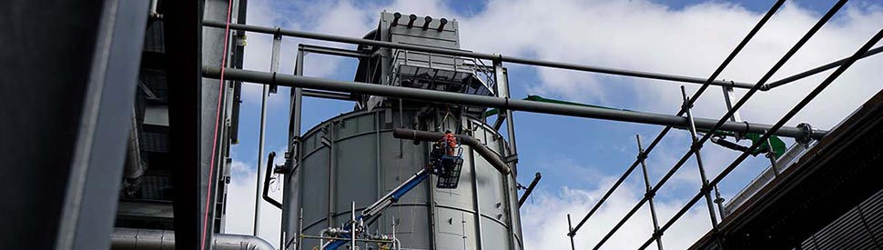 image of worker building gas plant