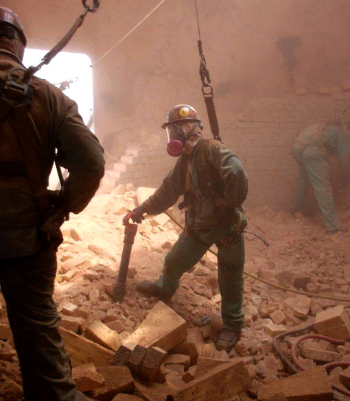 image of workers demoing industrial furnace