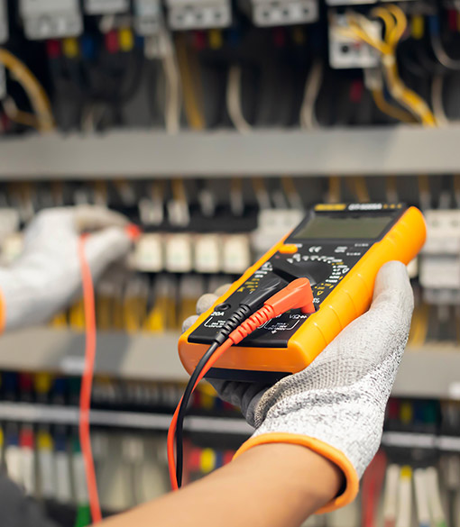 image of electrical engineer performing industrial testing