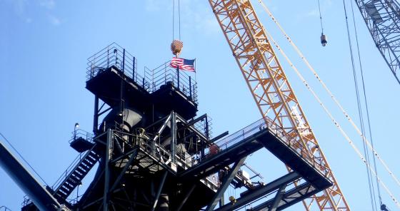 image of industrial jobsite and american flag